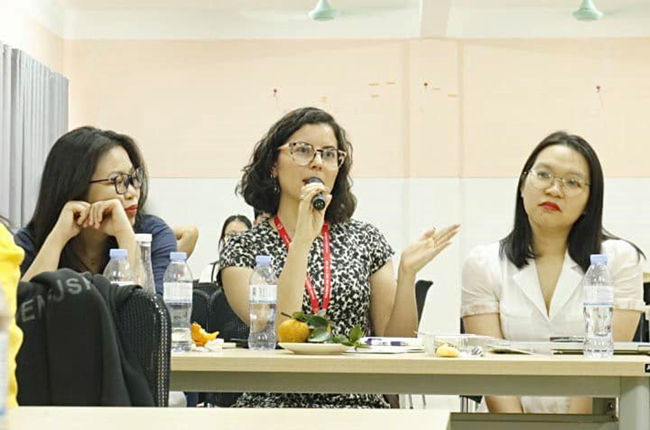 A group of women sitting at a table

Description automatically generated